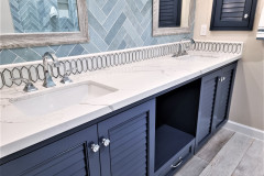 Quartz Countertop With Custom Louvered Maple Cabinets and Brizo Faucets