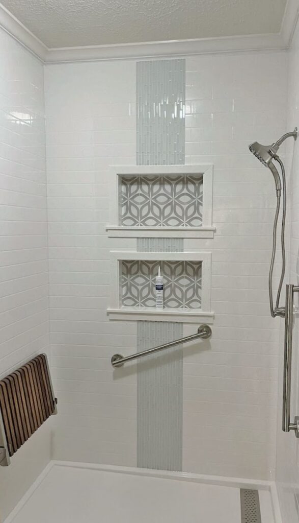 Solid Surface Shower With Trench Drain, Teak Seat, & Tile Accents - Fulshear, TX